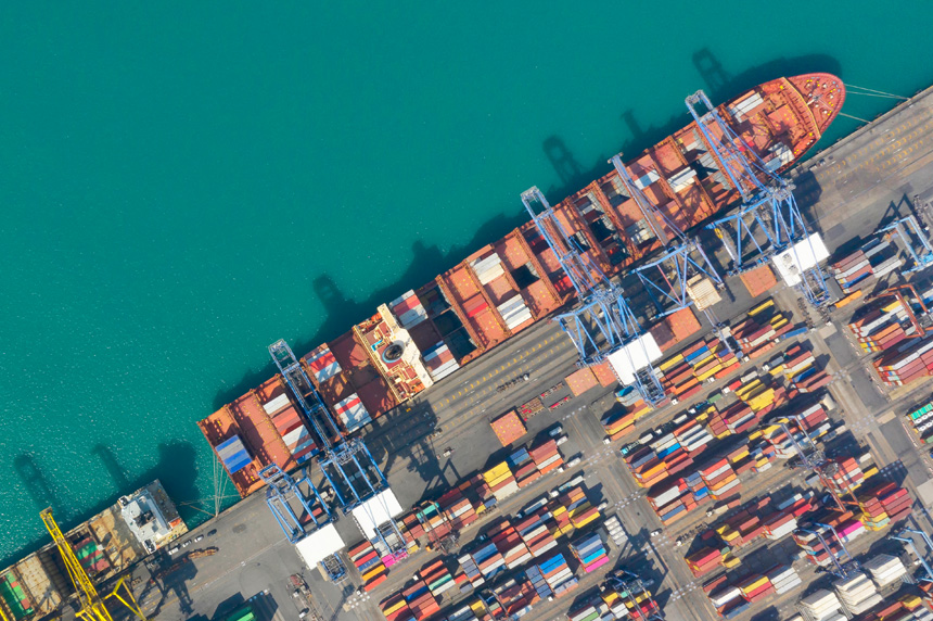 Overhead view of ship at port, re: OSINT for supply chain risk management
