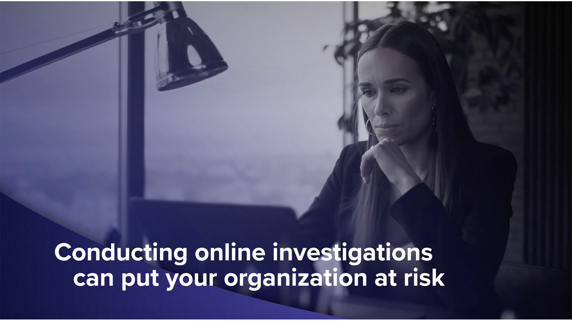 Woman looking at computer conducting OSINT investigation