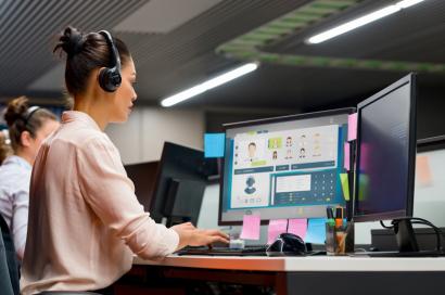 Woman sitting in a call center requesting third-party application access